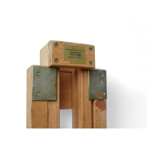 958 - A 20th century beech artist's studio easel - of folding tripod form with some paint transfer, fully ... 