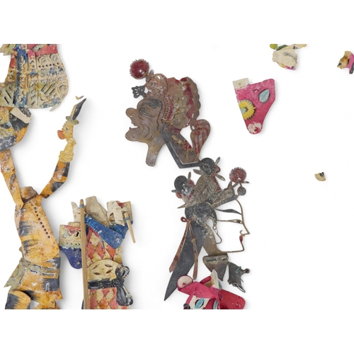 96 - A collection of early 20th century Balinese shadow puppets.