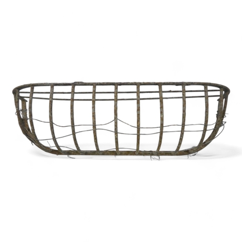 960 - A wrought steel manger - of quadrant form, 84cm wide.