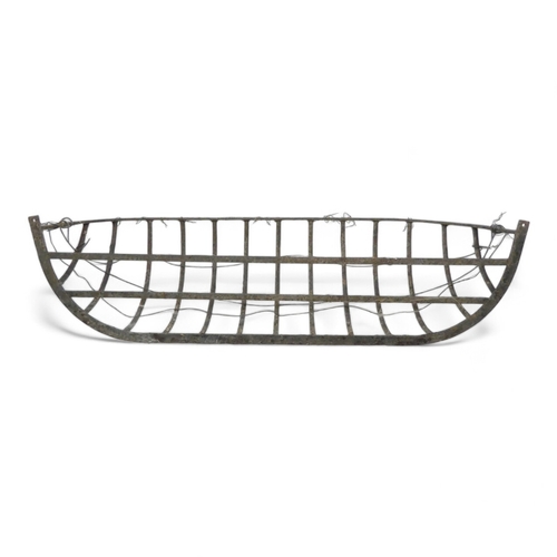 960 - A wrought steel manger - of quadrant form, 84cm wide.