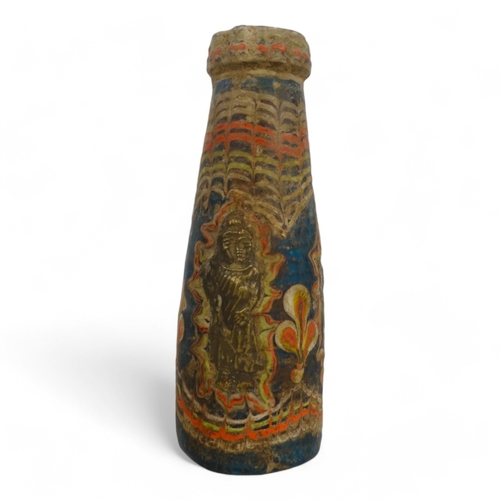 104 - A Persian glass bottle - of blue and red marbled design set three figures, 15cm high.