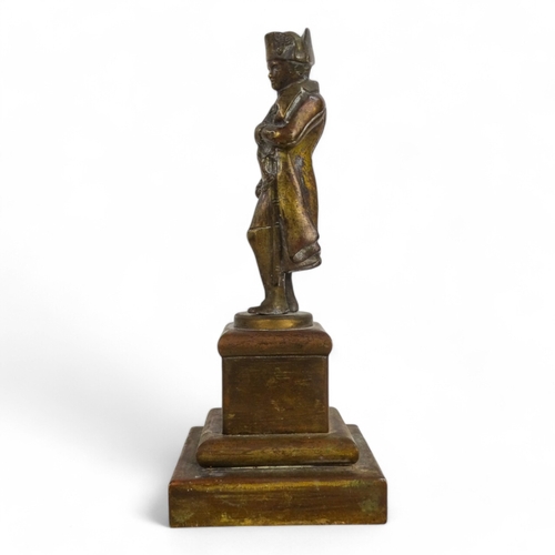 105 - A late 19th century bronzed figure of Napoleon - in a classic pose, raised on a square plinth.