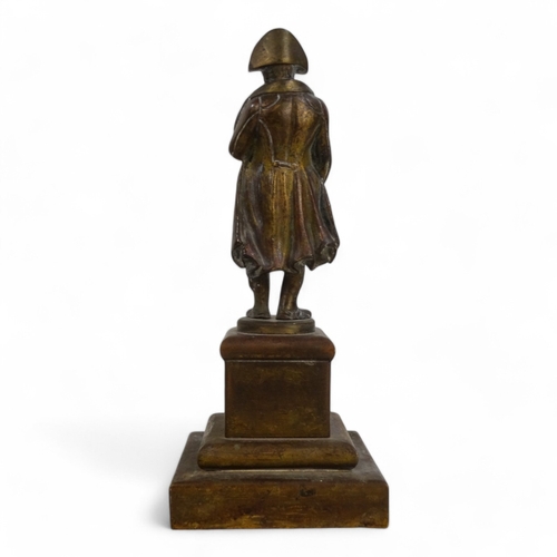 105 - A late 19th century bronzed figure of Napoleon - in a classic pose, raised on a square plinth.