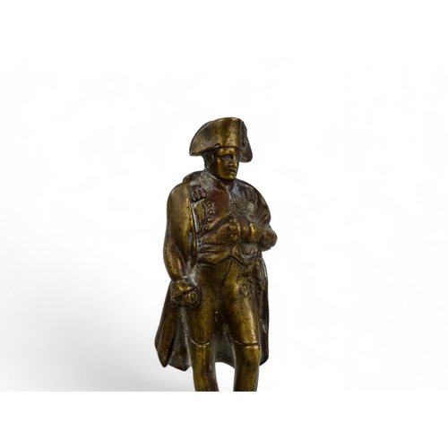 105 - A late 19th century bronzed figure of Napoleon - in a classic pose, raised on a square plinth.