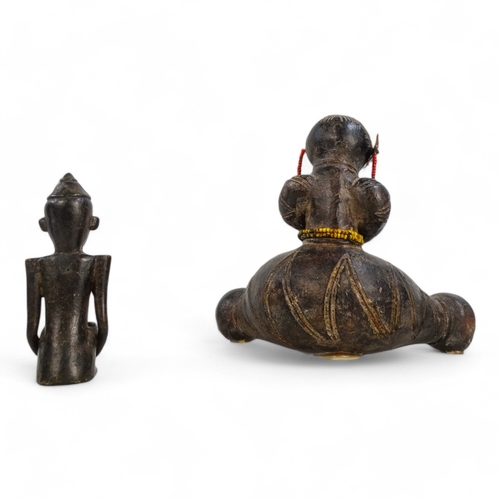 106 - A terracotta Namji fertility figure - seated with legs astride, mounted on an acrylic base, 15cm hig... 