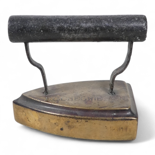 108 - A late 19th century flat iron - stamped E G Chegwidden, 14cm high.