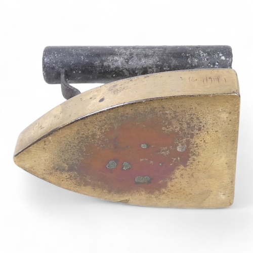 108 - A late 19th century flat iron - stamped E G Chegwidden, 14cm high.