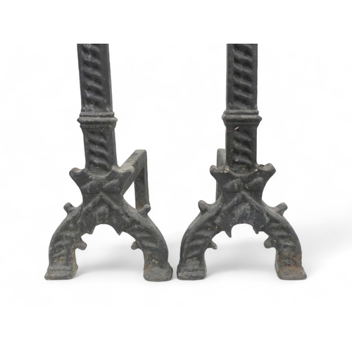 109 - A pair of 18th century cast iron fire dogs - 84cm high.