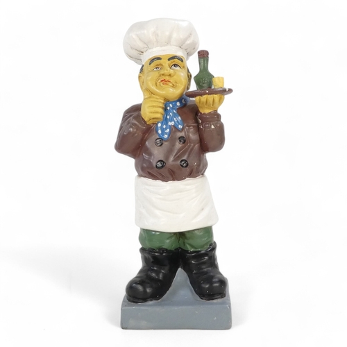 114 - A 20th century plaster cast figure - in the form of a quizzical chef holding a drinks tray, 51cm hig... 