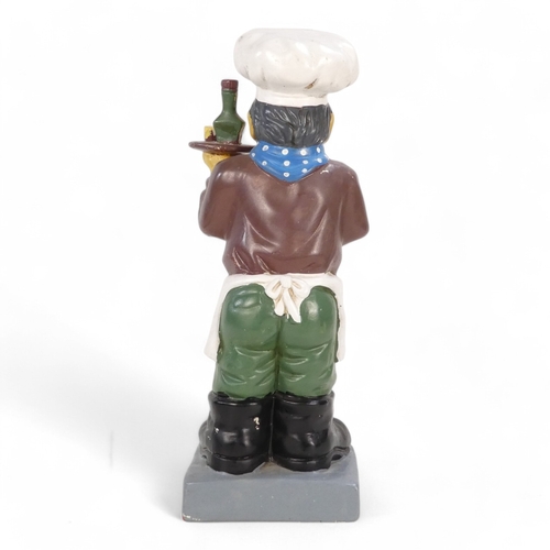 114 - A 20th century plaster cast figure - in the form of a quizzical chef holding a drinks tray, 51cm hig... 