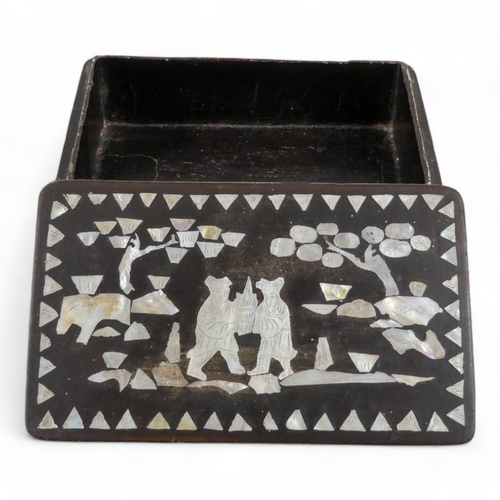 12 - An Anglo Indian glove box - extensively carved with flowers and foliage, including a temple scene, 2... 