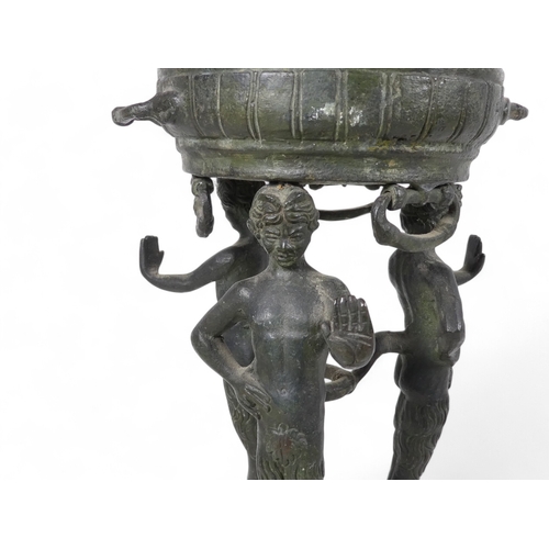 137 - A 19th century bronze torchiere - the cauldron on three faun supports, 26cm high.