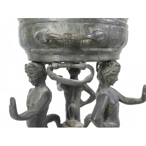 137 - A 19th century bronze torchiere - the cauldron on three faun supports, 26cm high.