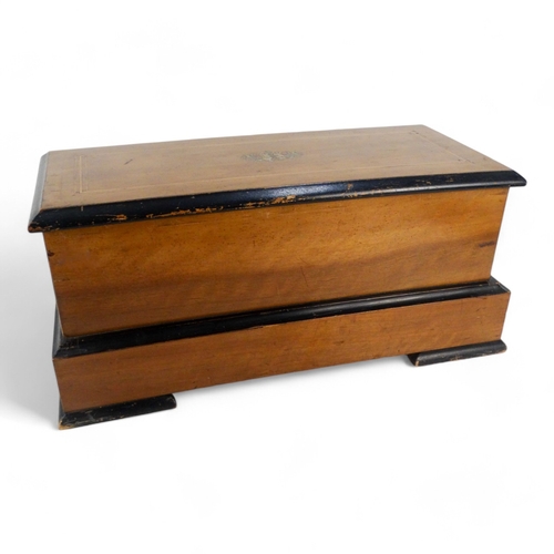 16 - A late 19th century cylinder music box - the rectangular walnut case with stringing and stencilled d... 