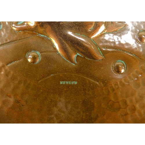 18 - A late 19th century Newlyn copper dish - circular and repousse decorated with a fish, stamped Newlyn... 