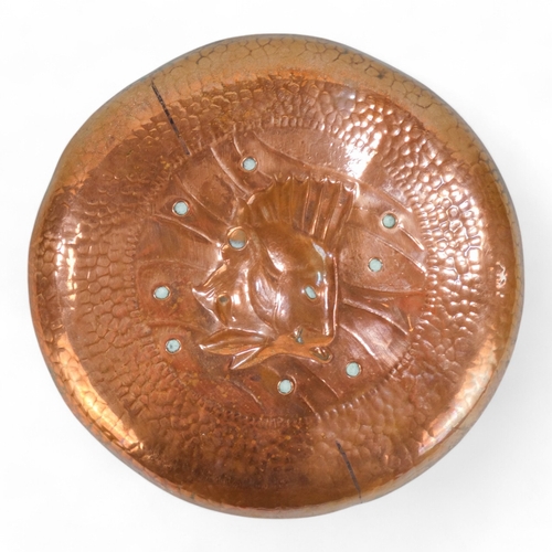 18 - A late 19th century Newlyn copper dish - circular and repousse decorated with a fish, stamped Newlyn... 