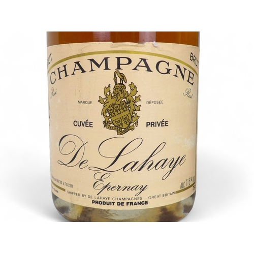 194A - A bottle of Mercier Demi-Sec champagne and a bottle of De Lahaye champagne.