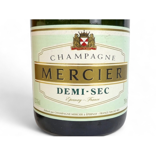 194A - A bottle of Mercier Demi-Sec champagne and a bottle of De Lahaye champagne.