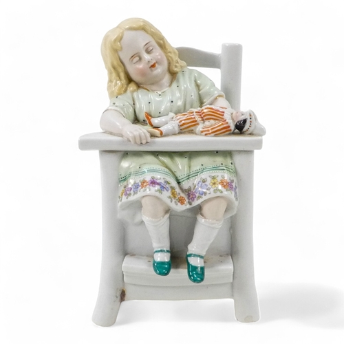 205 - A late 19th century German ceramic tobacco jar - modelled in the form of a child sleeping in a high ... 