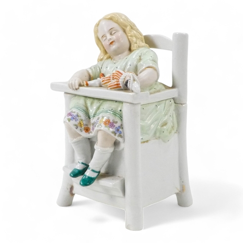 205 - A late 19th century German ceramic tobacco jar - modelled in the form of a child sleeping in a high ... 