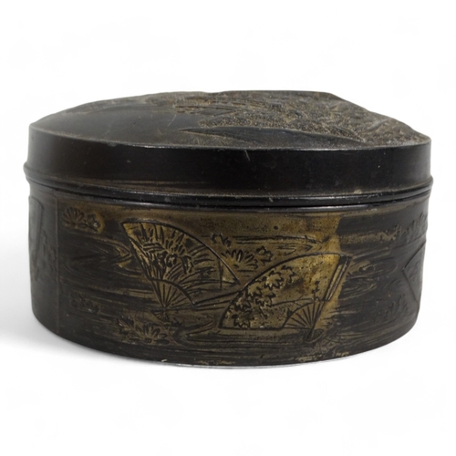 21 - A 20th century Japanese circular trinket box - decorated with a pagoda and landscape scenes, 9cm dia... 