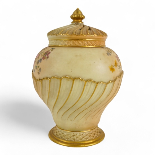 216 - A Royal Worcester potpourri - of part fluted squat baluster form, decorated with flowers on an ivory... 