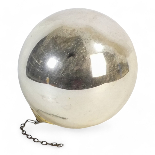 221 - A 19th century silvered witches ball - 25cm diameter.