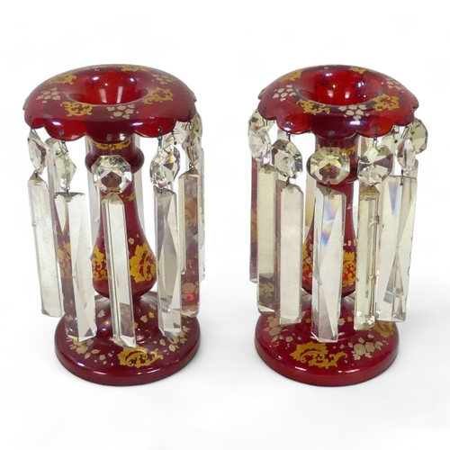 227 - A pair of Bohemian ruby glass table lustres - with gilt foliate decoration and clear glass drops, 24... 