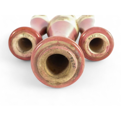 229 - Four early 20th century ceramic beer pump handles - of typical baluster form, pink and white with fl... 