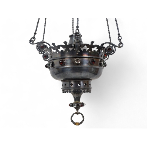 23 - A Moorish style hanging lamp - with a crown shaped central rose, the reservoir encrusted with a band... 