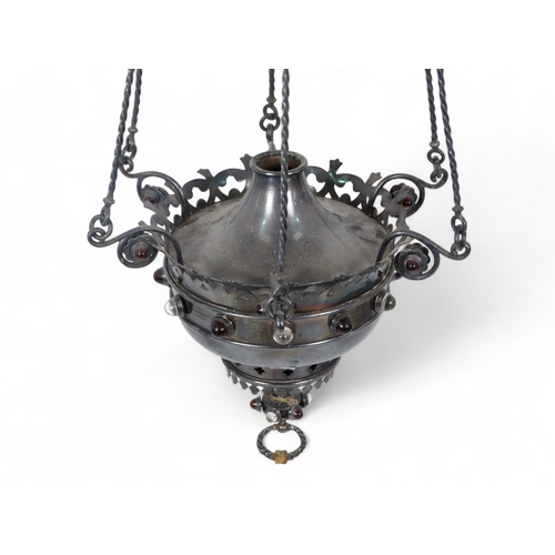 23 - A Moorish style hanging lamp - with a crown shaped central rose, the reservoir encrusted with a band... 