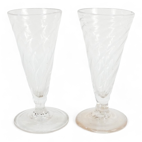 230 - A pair of spiral twist ale glasses - clear glass of tapering form with foot rims, 12cm high, togethe... 