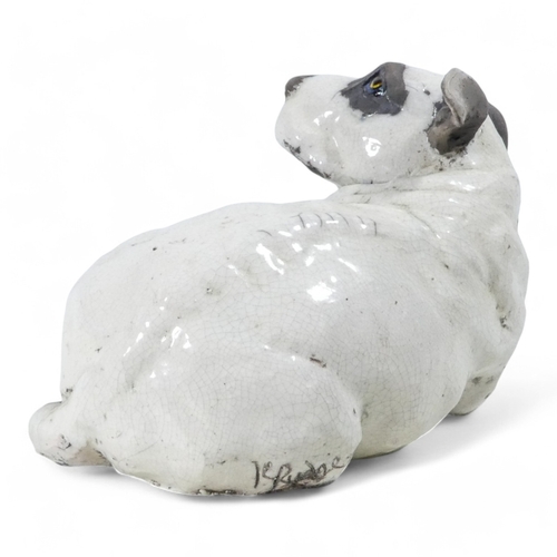 237 - Keza Rudge (British 20th/21st Century) - a spaniel picking up a scent, with raku glaze, signed to un... 