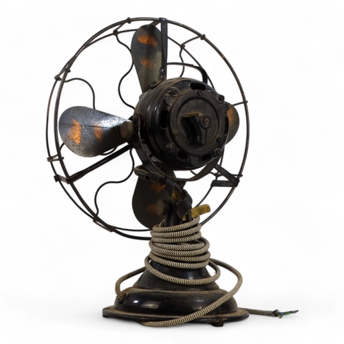 24 - A vintage electric desk fan, GEC, with bronzed blades and black finished body, 50cm high.