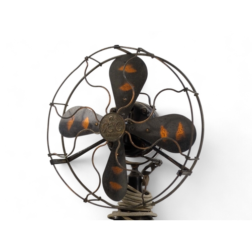 24 - A vintage electric desk fan, GEC, with bronzed blades and black finished body, 50cm high.