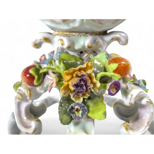 240 - A pair of Schierholz porcelain twin handled vases - each floral and fruit encrusted including a pier... 