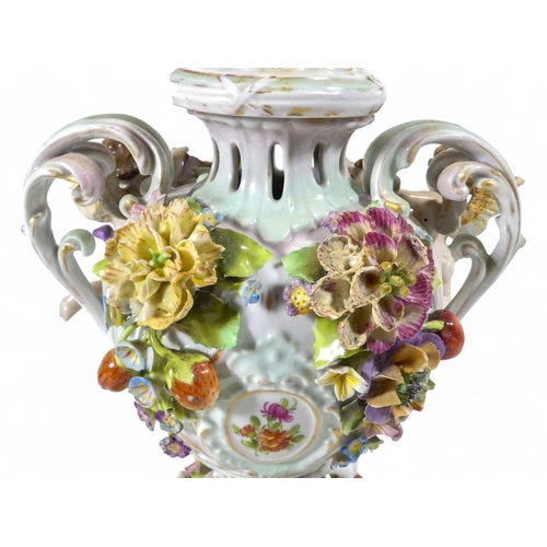 240 - A pair of Schierholz porcelain twin handled vases - each floral and fruit encrusted including a pier... 