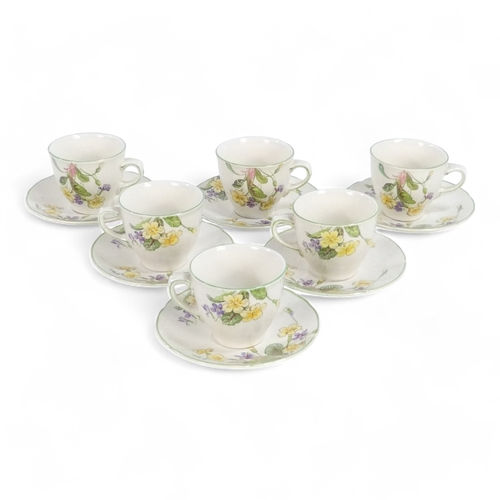 254 - A Royal Doulton tea service - April pattern, comprising six cups and saucers.