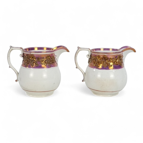 256 - A pair of late 18th century copper lustre jugs - decorated with a grape band, 12cm high. (2)