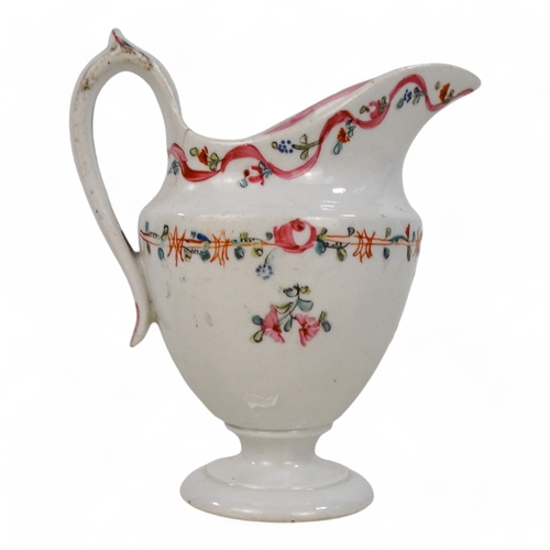 260 - A late 18th century helmet shaped cream jug - decorated with floral sprigs on a cream ground, 12cm h... 