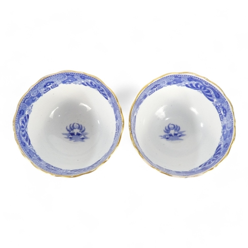 261 - An early 19th century English blue and white tea bowl - chinoiserie decoration, two figures on a bri... 