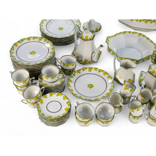 281 - A 20th century Limoges dinner service - decorated with lemons and leaves on a white ground, includin... 