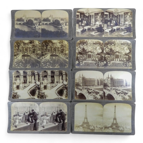 29 - A late 19th century stereoscopic slide viewer - together with a group of slides by Underwood and Und... 