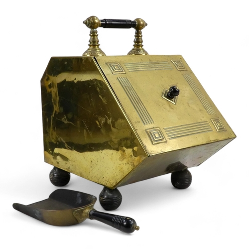 3 - An early 20th century brass coal scuttle - with sloping hinged cover, turned ebonised handle and a s... 