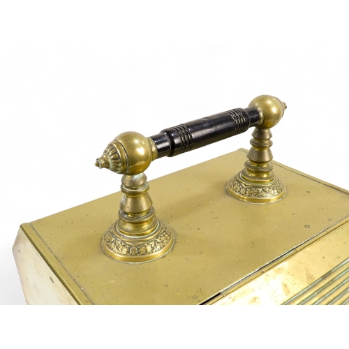 3 - An early 20th century brass coal scuttle - with sloping hinged cover, turned ebonised handle and a s... 