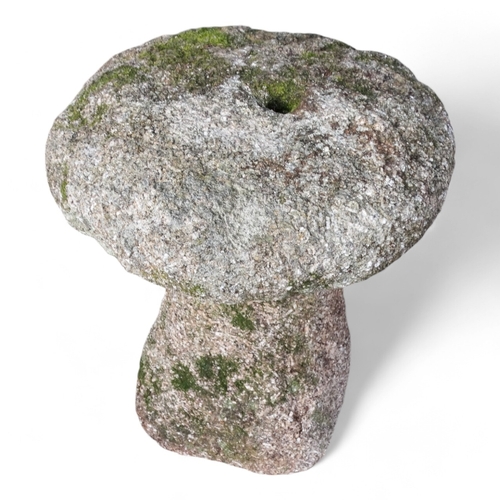 31 - A granite staddle stone - 64cm high.