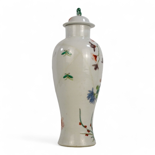 311A - A 19th century Chinese Kangxi vase and cover - of baluster form, decorated with a bird amongst branc... 