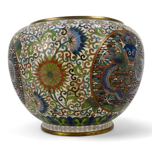 312 - An early 20th century Japanese cloisonne bowl - decorated with dragon panels on an intense foliate g... 