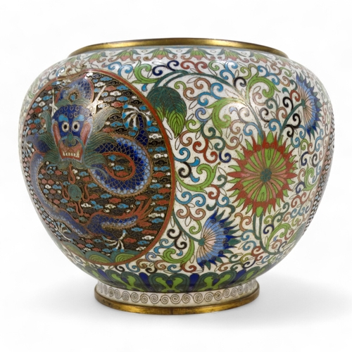 312 - An early 20th century Japanese cloisonne bowl - decorated with dragon panels on an intense foliate g... 