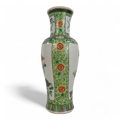 312A - A Chinese famille verte vase - decorated with panels showing exotic birds amongst branches, 35cm hig... 